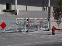 iron-anvil-gates-by-others-driveway-flat-chain-link