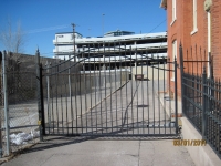 iron-anvil-gates-by-others-driveway-french-curve-spear-top-double-top