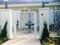 iron-anvil-gates-by-others-man-flat-fancy-scrolls