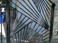 69-0068-Iron-Anvil-Gates-Man-Arch-MODERN-GATE-IN-AVENUES-by-others-99-
