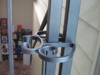 iron-anvil-gates-man-arch-la-brett-litster-15925-latch-springbar