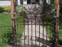 iron-anvil-gates-man-arch-repair