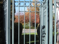 iron-anvil-gates-man-flat-tall-oaks-entry