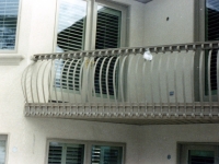 iron-anvil-railing-belly-rail-single-top-flat-bar-scroll-top-above-capitol
