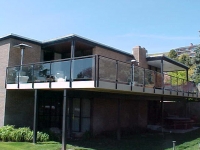 iron-anvil-railing-glass-peterson-avenues-1