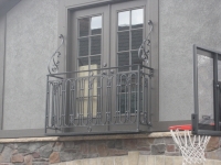 iron-anvil-railing-scrolls-and-patterns-repeating-circles-la-brett-job-14197-peter-mousdkondis-8