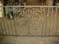 iron-anvil-railing-scrolls-and-patterns-window-bishop-curved-rail-1