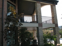 iron-anvil-railing-single-top-collars-ferran-kilgore-gate-grand-stair-railing-3