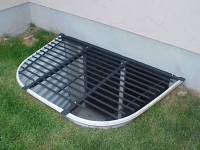 iron-anvil-security-grates-adjustable-grass