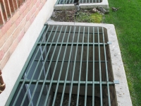 iron-anvil-security-grates-adjustable-lee-irvine