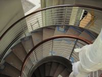 41-0030-iron-anvil-stairs-grand-circular-treads-angle-iron-wood-step-stainless-steel-watts-larson-by-others-2
