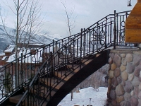 41-0040-iron-anvil-stairs-grand-circular-treads-angle-iron-wood-steps-park-city-2