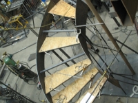 41-0060iron-anvil-stairs-grand-circular-treads-concrete-13415-ferran-kilgore-1
