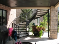 41-0060-iron-anvil-stairs-grand-circular-treads-concrete-13415-ferran-kilgore-5