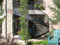 41-0060-iron-anvil-stairs-grand-circular-treads-concrete-13415-ferran-kilgore-6