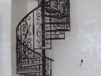 iron-anvil-stairs-spiral-angle-iron-plywood-integrated-2300-east-1