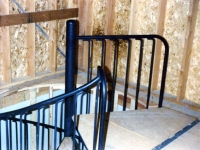 iron-anvil-stairs-spiral-angle-iron-plywood-picket-bend-at-top-41-1028-4