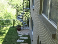 iron-anvil-stairs-spiral-wood-trex-wood-fix-it-wright-1